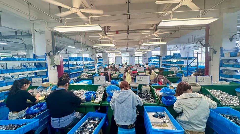 SJJ assembly line workers assembling smart lock components on the production floor